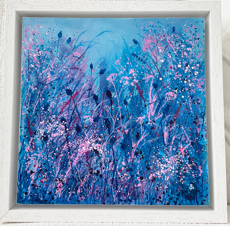 Framed Fragrant Meadow painting in blues, pinks and purples in a white wooden frame by Beverley Perry Artist